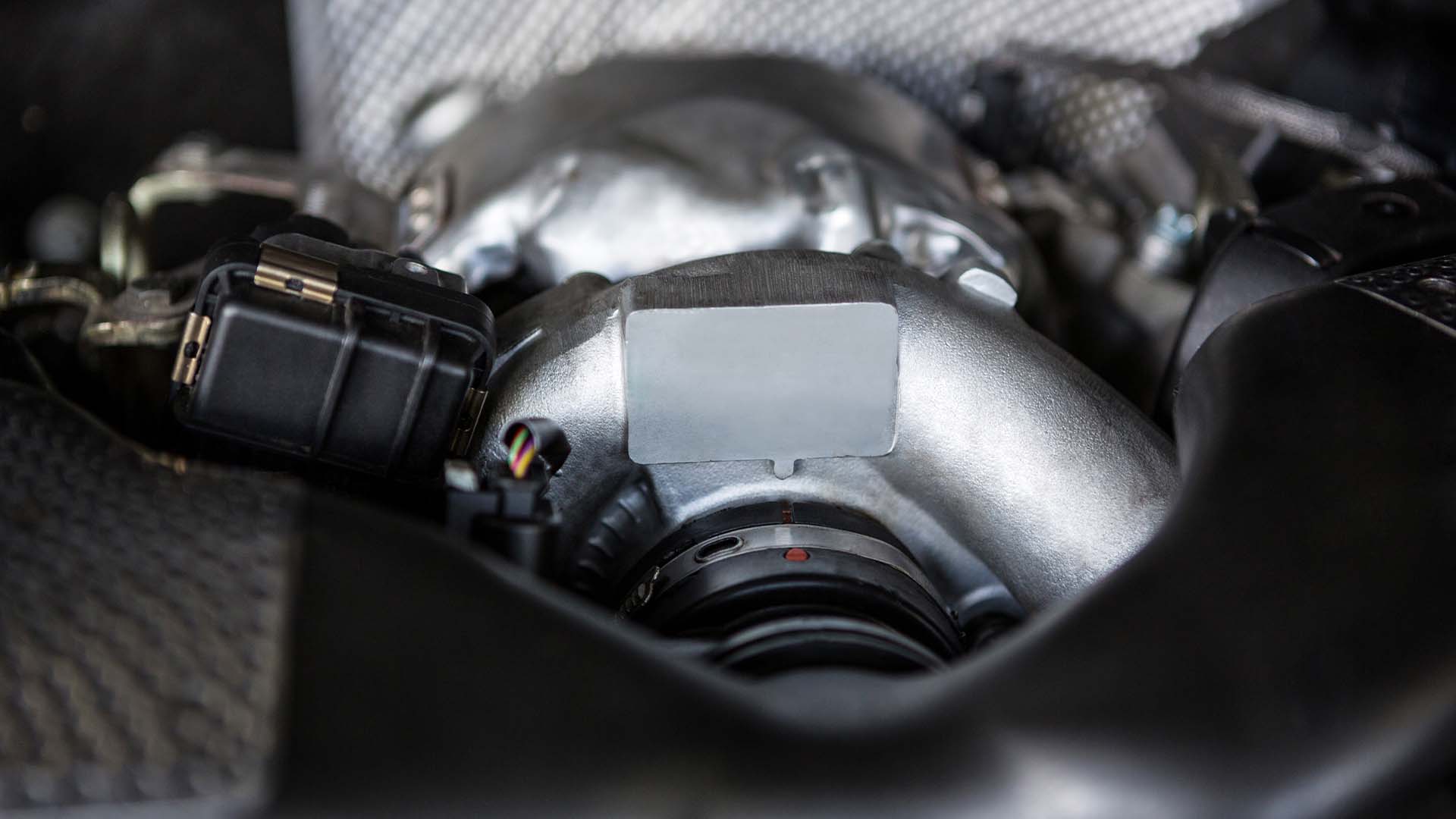 Photo of Audi car engine experiencing reduced engine power, rough idiling, poor fuel economy and a decrease in acceleration (P010100/P0101).
