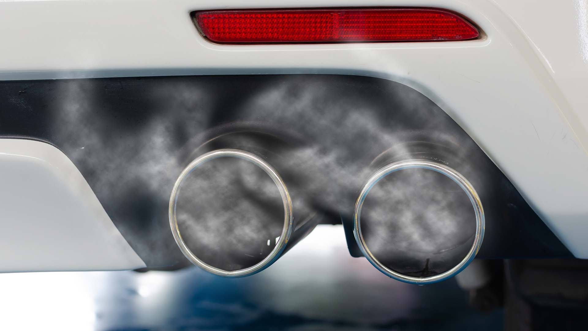 Photo of a dual Audi exhaust suffering high emissions leading to hesitation or stalling when accelerating and reduced power.